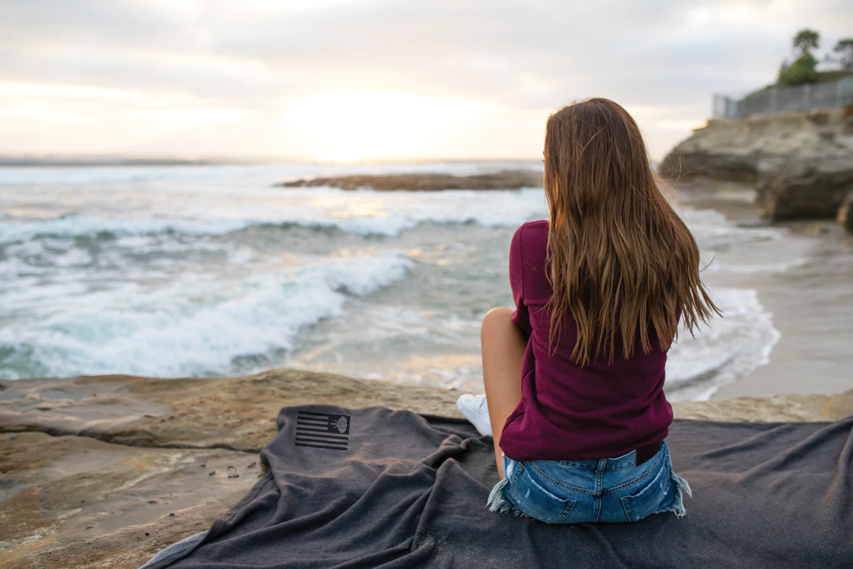 This super cozy blanket offers all the benefits of our cozy sweatshirts and hoodies. Whether you are watching your favorite show on the couch, tailgating at the game, or watching the sunset on the beach, this ultra soft blanket provides the ultimate way to stay warm and cozy.